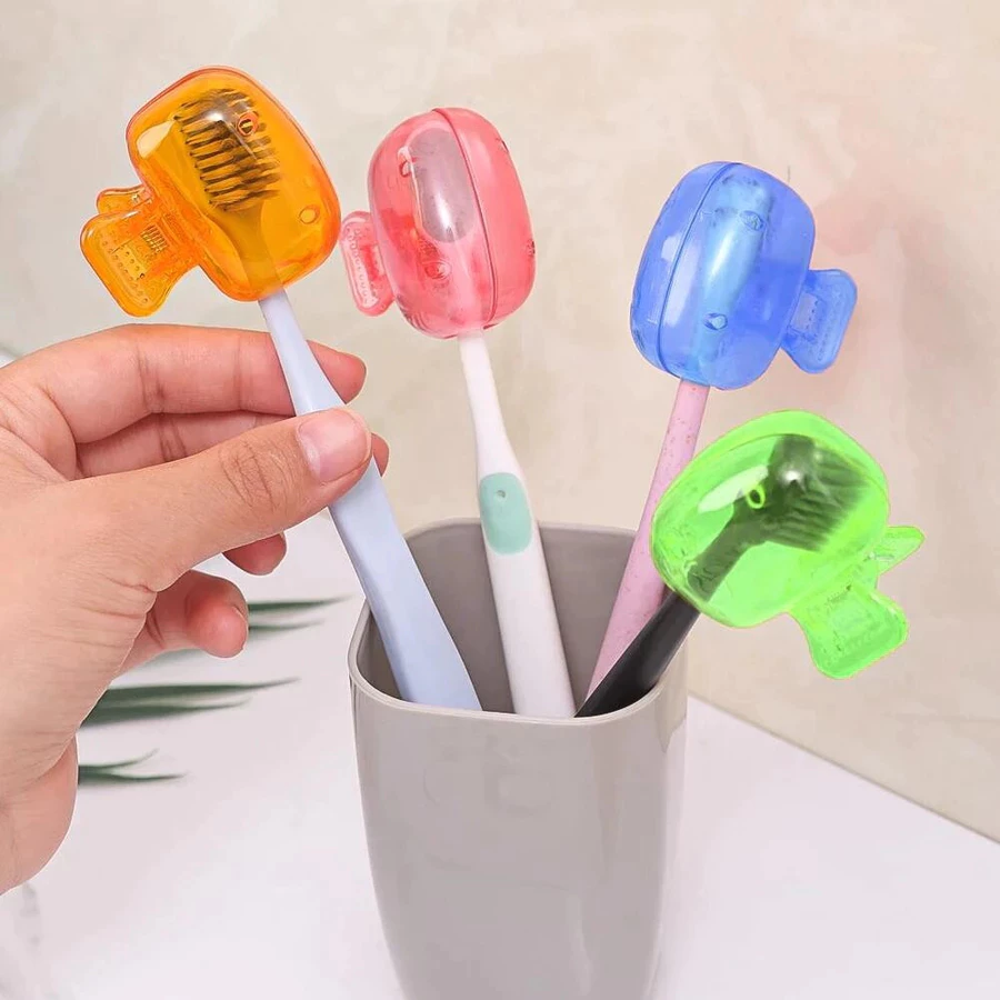 Colorful clip-style toothbrush head covers pictured on toothbrushes